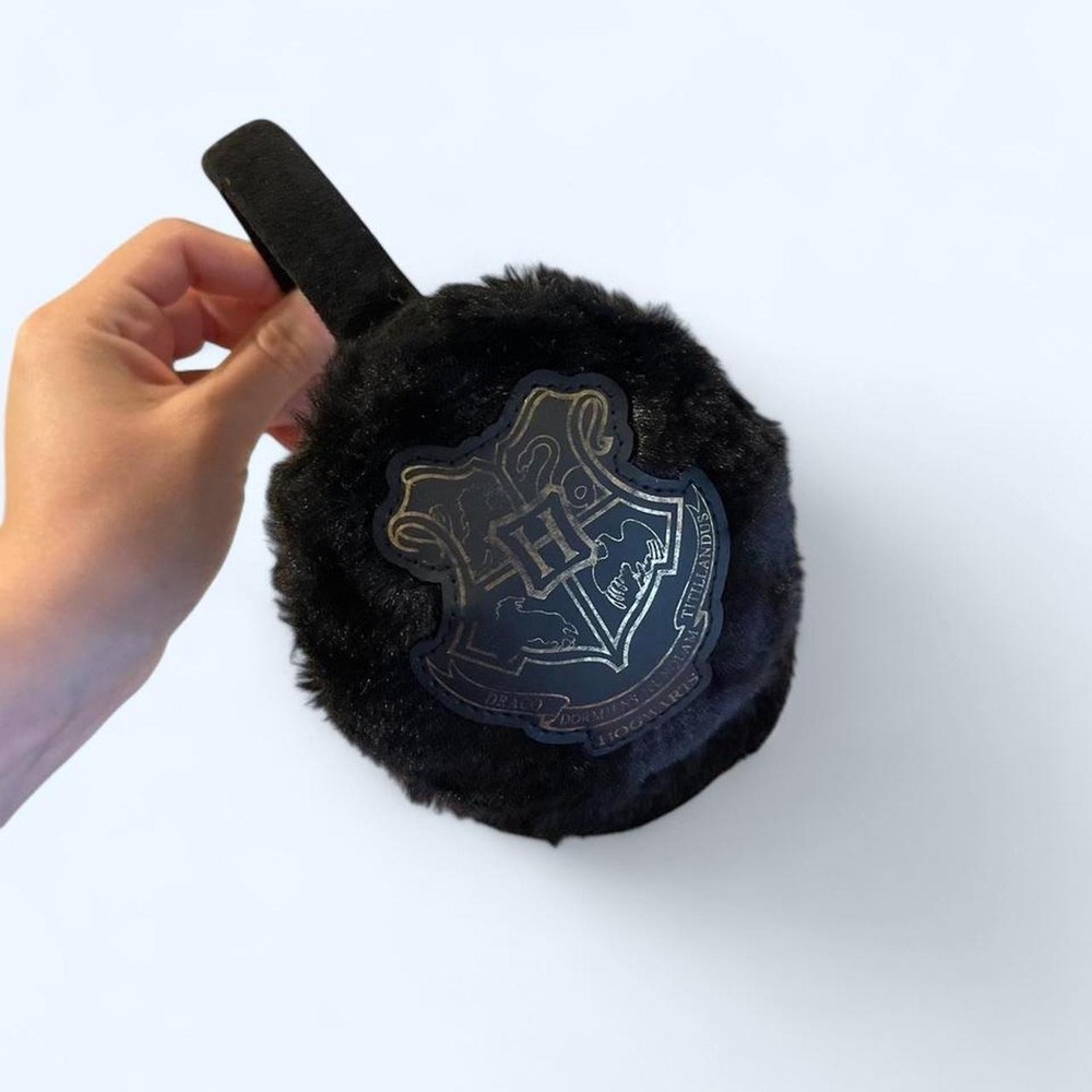 Harry Potter black faux fur earmuffs with silver Hogwarts crest‎